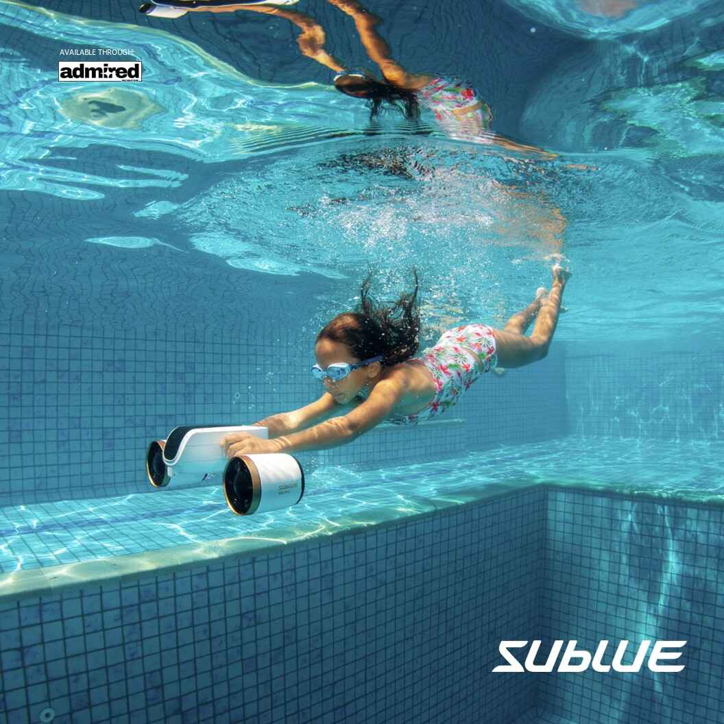 Child gliding underwater with SUBLUE MixPro scooter in a bright pool.